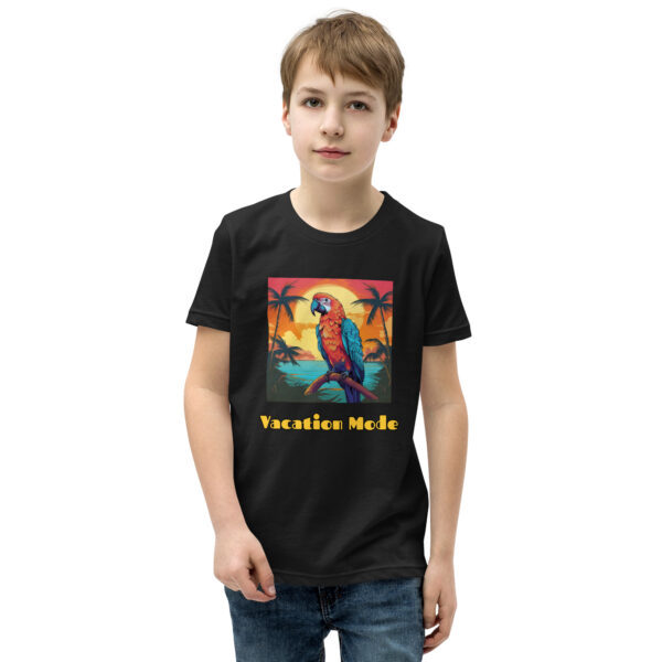 Youth classic graphic t-shirt featuring a parrot perched on a tropical tree branch against a scenic beach background, with the text 'Vacation Mode', evoking a sense of relaxation and tropical paradise